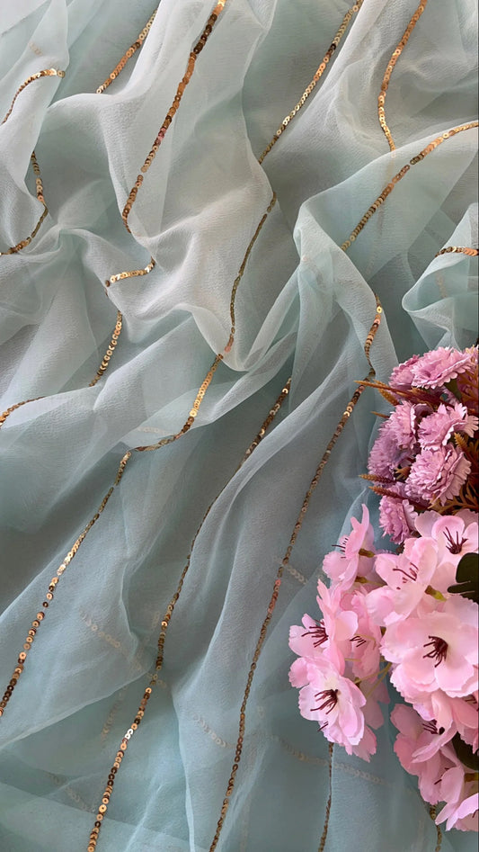 Powder blue shaded sequins saree